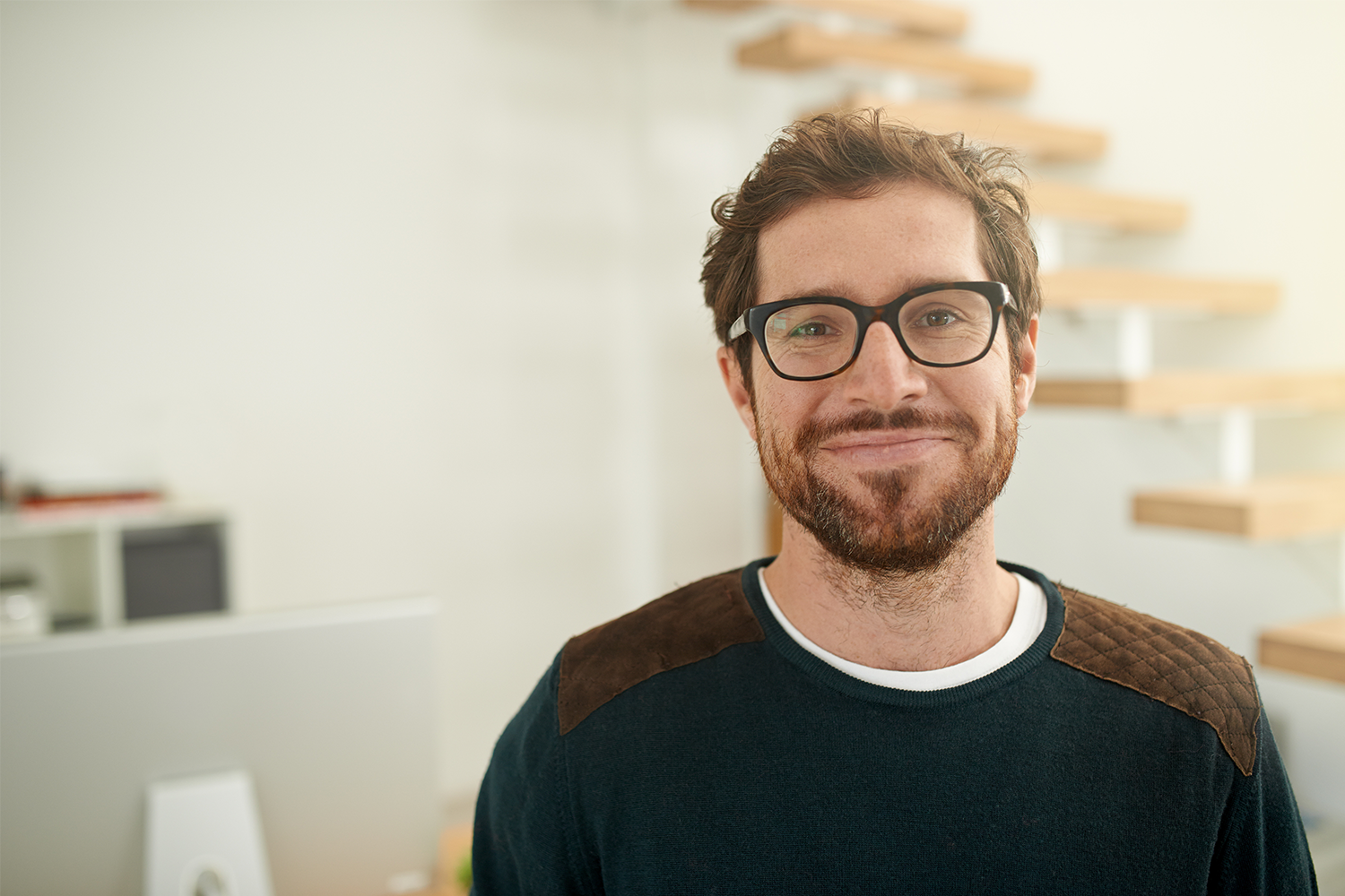 smiling man wearing glasses