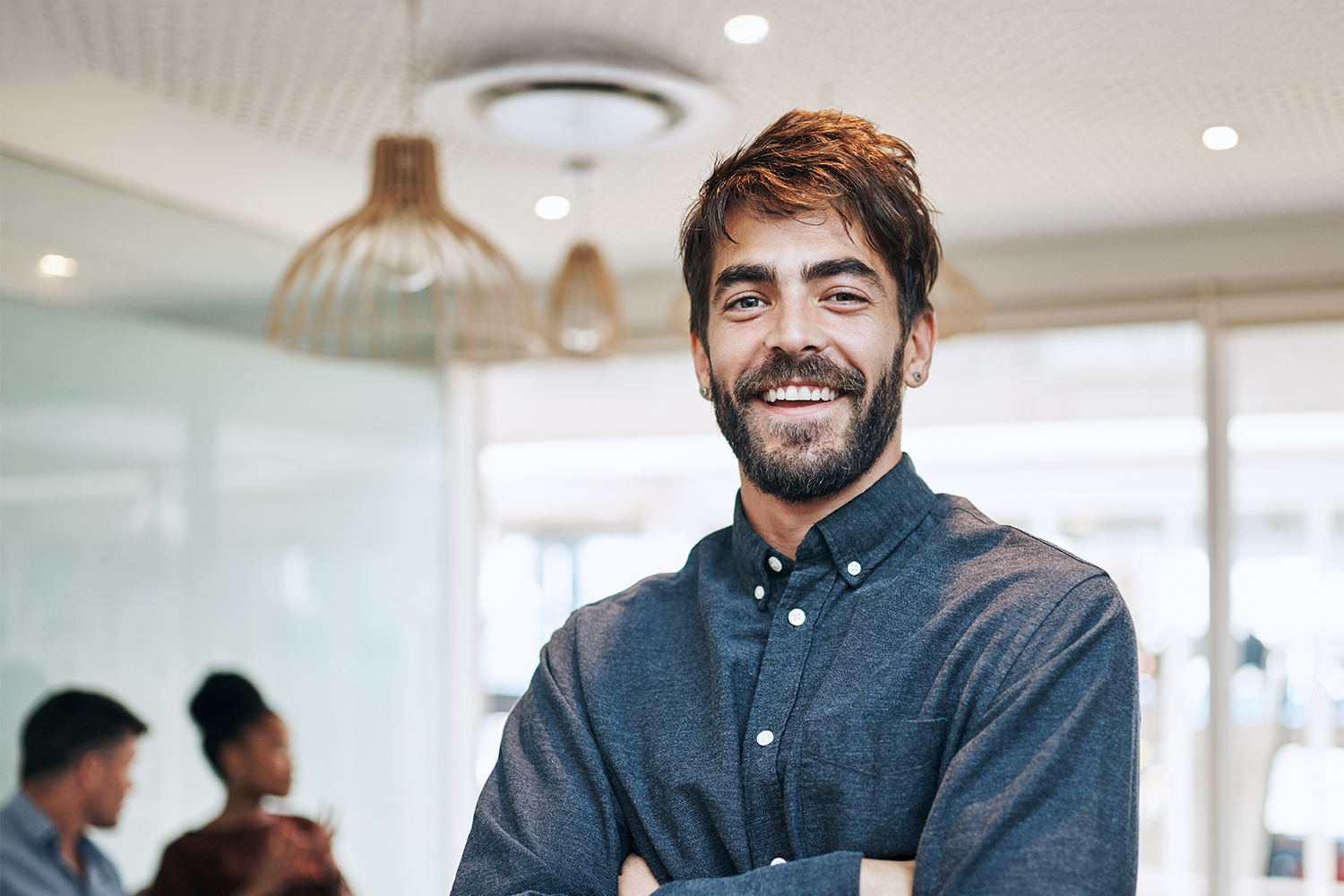 smiling man arms crossed
